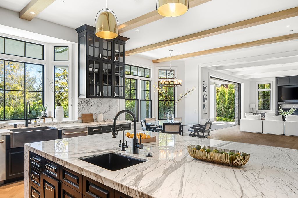 The Mansion in Los Angeles is a new construction dream estate on a long private drive on the most exclusive street in prime Brentwood Park now available for sale. This home located at 22 Oakmont Dr, Los Angeles, California