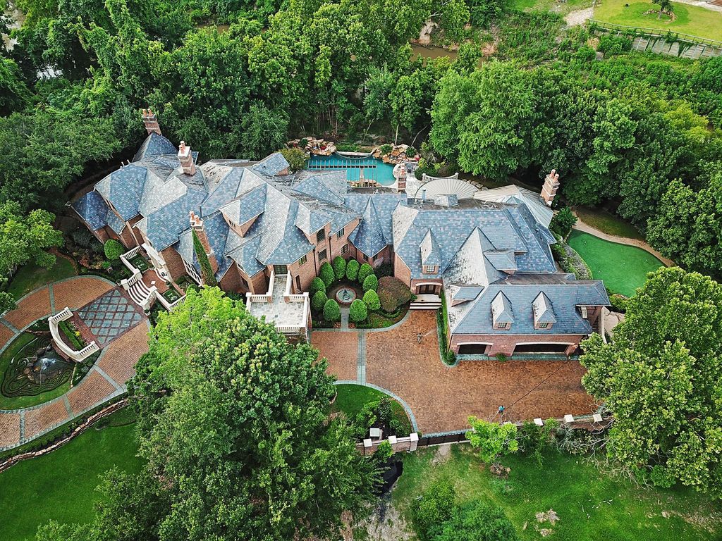 The English Manor Mansion in Houston is a one of the most significant Piney Point estate properties offers the ultimate livability now available for sale. This home located at 11002 Wickwood Dr, Houston, Texas