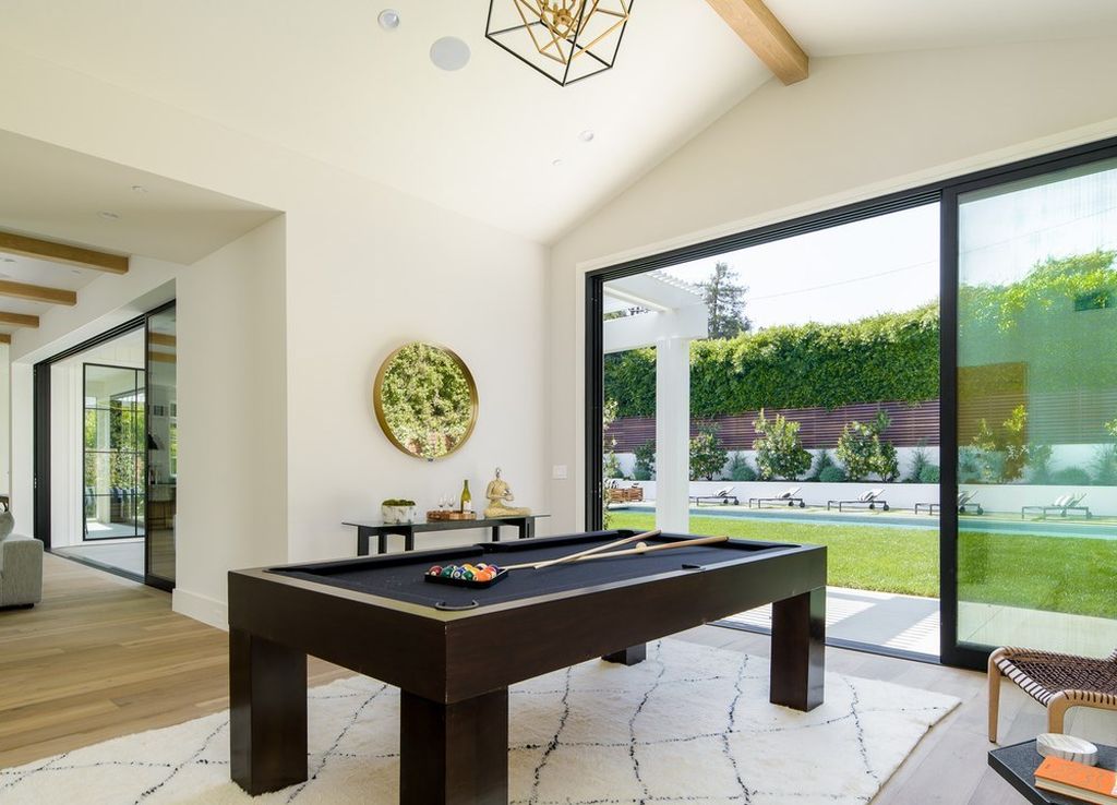 The Brentwood Modern Farmhouse is a stunning newly built property with the finest materials and an amazing backyard oasis now available for sale. This home located at 12825 San Vicente Blvd, Los Angeles, California