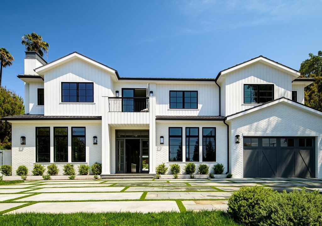 The Brentwood Modern Farmhouse is a stunning newly built property with the finest materials and an amazing backyard oasis now available for sale. This home located at 12825 San Vicente Blvd, Los Angeles, California