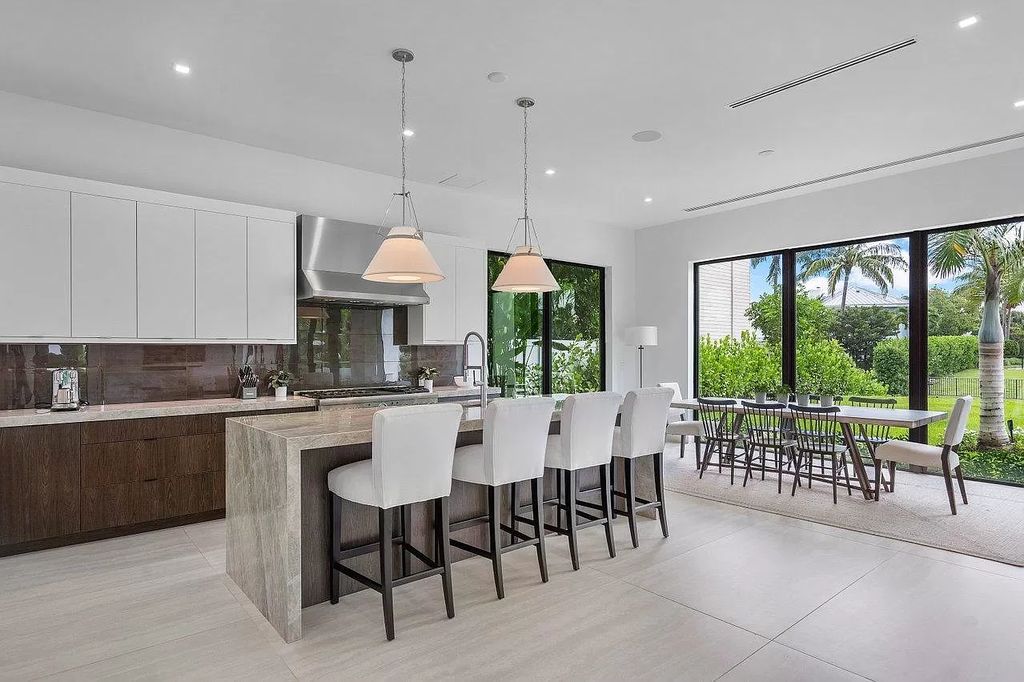 The Home in Delray Beach is a spacious custom new build on Lake Ida wrapped in high-end finishes and bathed in brilliant light now available for sale. This home located at 255 NW 22nd St, Delray Beach, Florida