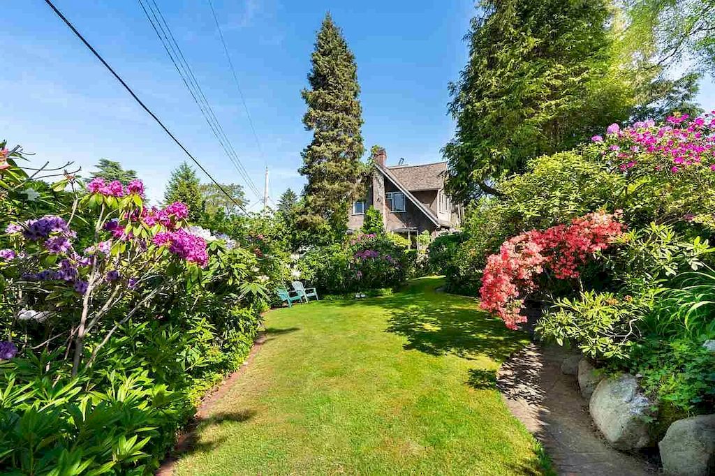 The Lovely House in Vancouver is surrounded by incredible gardens now available for sale. This home is located at 2588 Courtenay St, Vancouver, BC V6R 3X3, Canada