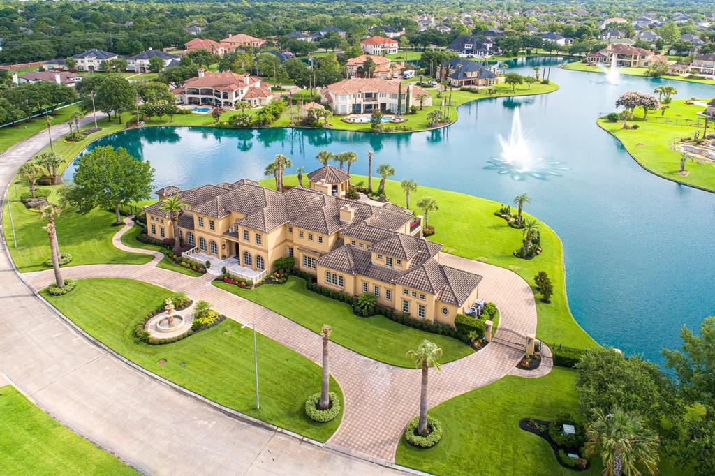 The Texas Home is a magnificent property sitting on a private peninsula lake lot in Katy offers luxurious living now available for sale. This home located at 2607 Morganfair Ln, Katy, Texas