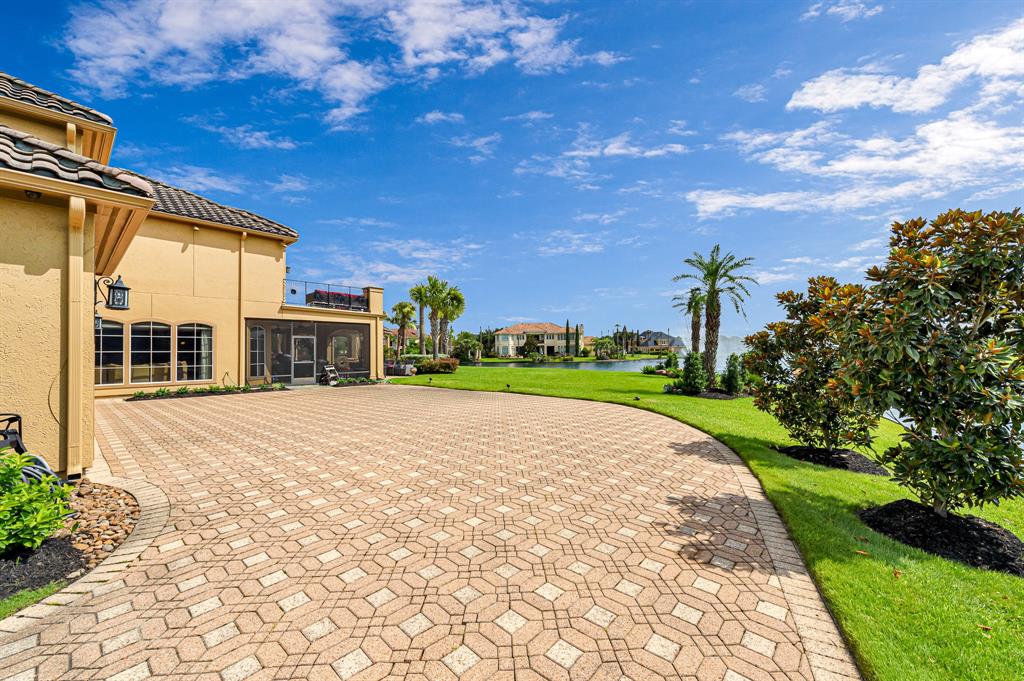 The Texas Home is a magnificent property sitting on a private peninsula lake lot in Katy offers luxurious living now available for sale. This home located at 2607 Morganfair Ln, Katy, Texas