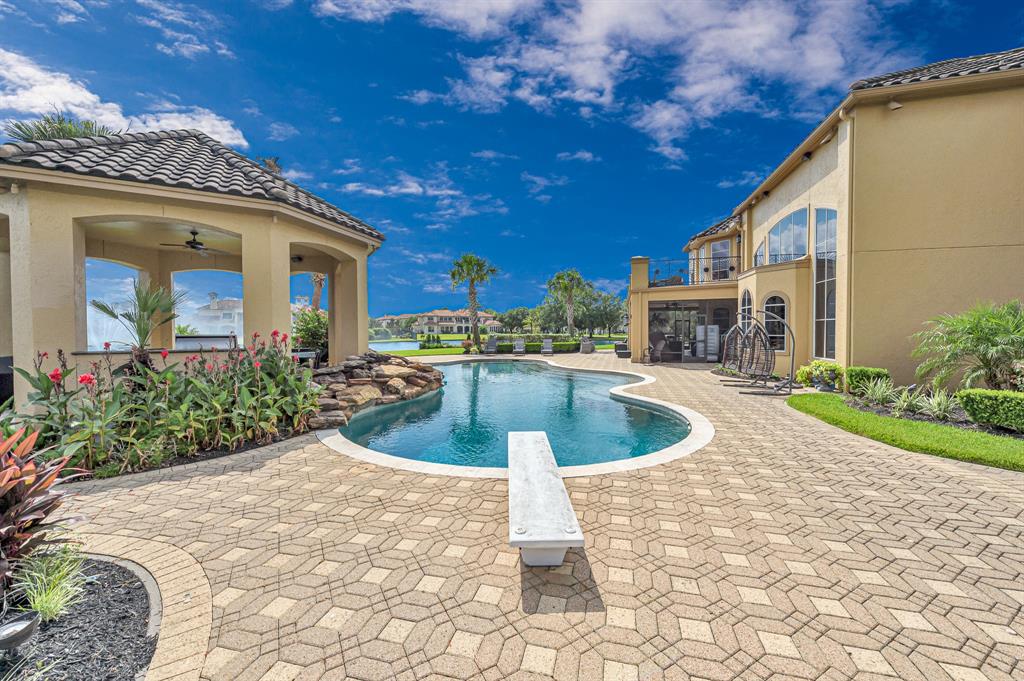 The Texas Home is a magnificent property sitting on a private peninsula lake lot in Katy offers luxurious living now available for sale. This home located at 2607 Morganfair Ln, Katy, Texas