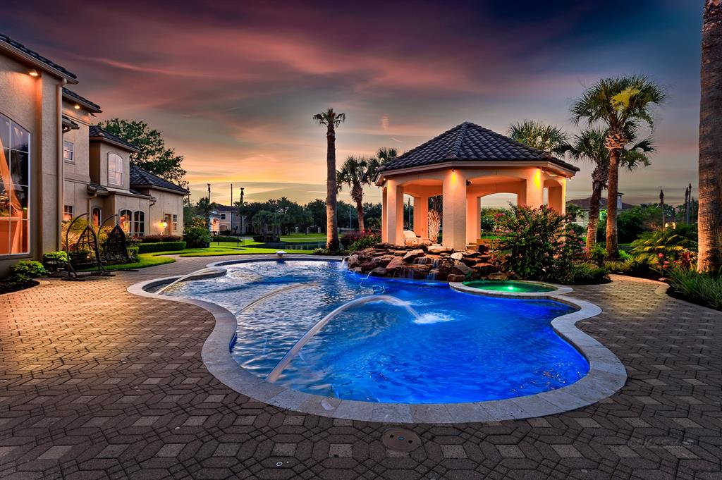 The Texas Home is a magnificent property sitting on a private peninsula lake lot in Katy offers luxurious living now available for sale. This home located at 2607 Morganfair Ln, Katy, Texas