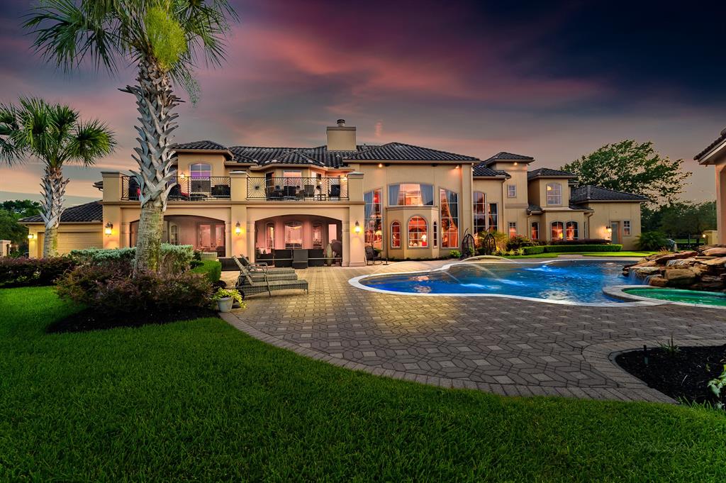 The Texas Home is a magnificent property sitting on a private peninsula lake lot in Katy offers luxurious living now available for sale. This home located at 2607 Morganfair Ln, Katy, Texas