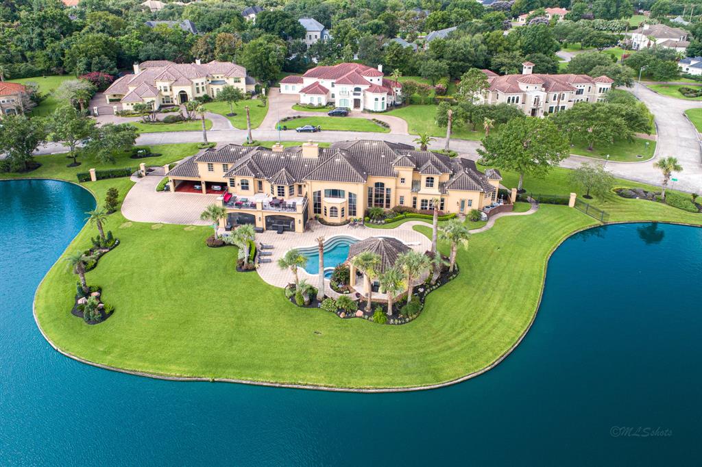 The Texas Home is a magnificent property sitting on a private peninsula lake lot in Katy offers luxurious living now available for sale. This home located at 2607 Morganfair Ln, Katy, Texas