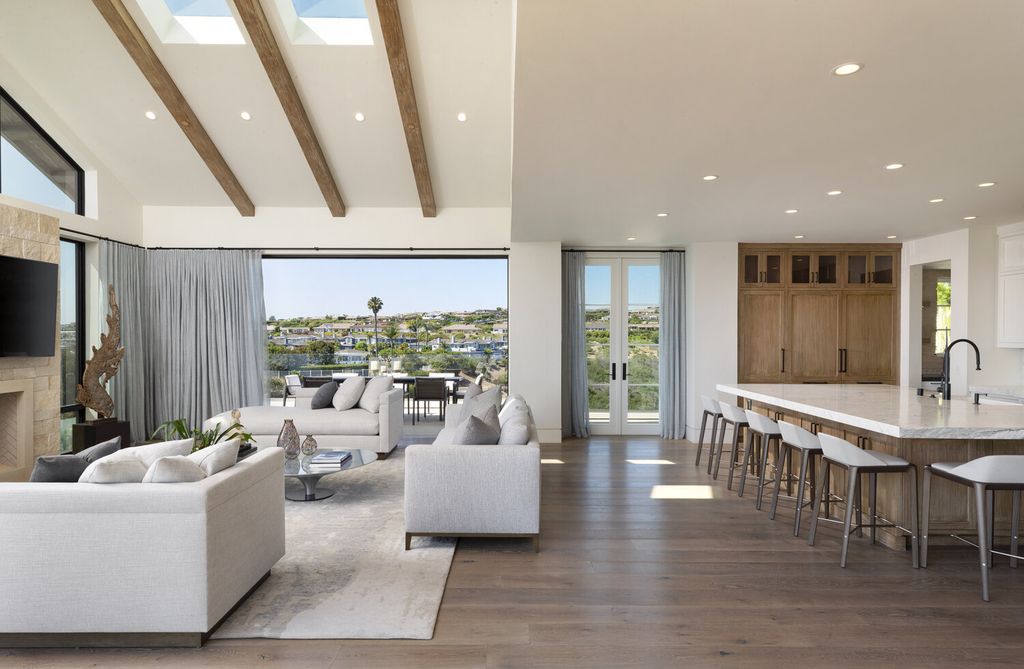 The Home in Corona Del Mar is a contemporary ocean view residence features sweeping ocean and Catalina views now available for sale. This home located at 409 De Sola Ter, Corona Del Mar, California
