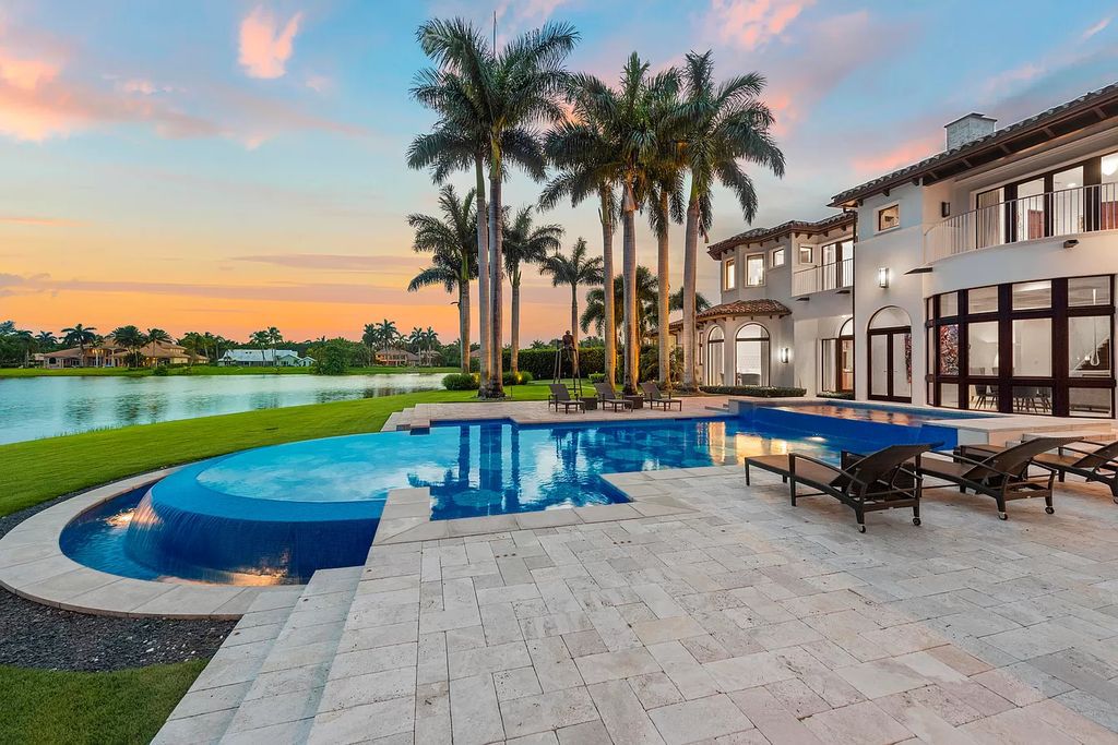 The Mediterranean Mansion in Boca Raton is a luxurious estate with over one acre on a cut-de-sac location and magnificent waterfront vistas now available for sale. This home located at 8808 Twin Lake Dr, Boca Raton, Florida