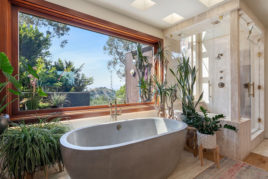 The Beverly Hills Home is a architectural compound sits behind gates on 2.38 acres on the famed Mulholland corridor now available for sale. This home located at 12835 Mulholland Dr, Beverly Hills, California