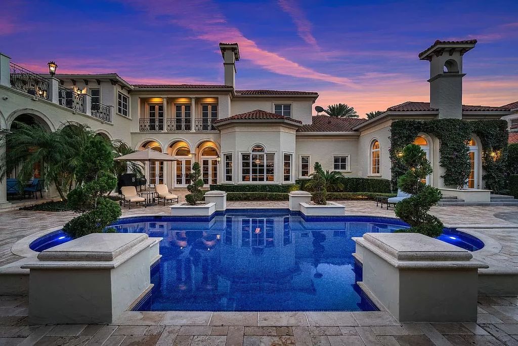 The Boca Raton Home is a luxurious five-bedroom estate complemented by the refreshed decor, seamlessly blending clean lines and traditional elegance now available for sale. This home located at 1869 Sabal Palm Dr, Boca Raton, Florida
