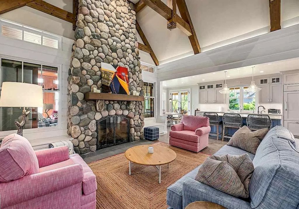 All of these sceneries have a rustic feel to them, from the overall design to the interior materials used. A country photo is portrayed through diverse living room ideas with a vintage fireplace and wooden spire beams. But the homeowner doesn't stop there; a pink sofa serves as a focal point with youthful qualities. As the material produces old tones of pink, the addition of this color does not generate excess.