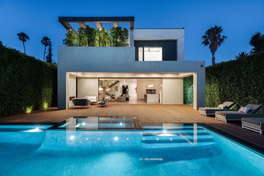 The Los Angeles Home is a beautifully scaled newer construction smart property has rooftop deck with fireplace, city and mountain views now available for sale. This home located at 439 N Martel Ave, Los Angeles, California;