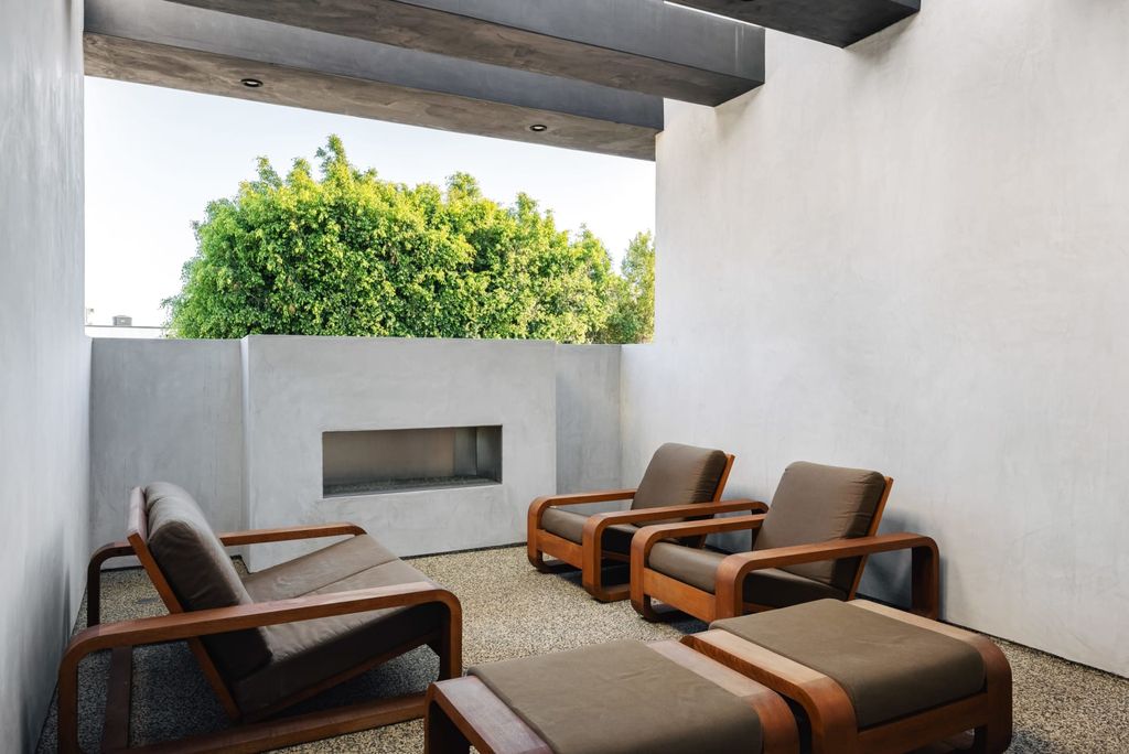 The Los Angeles Home is a beautifully scaled newer construction smart property has rooftop deck with fireplace, city and mountain views now available for sale. This home located at 439 N Martel Ave, Los Angeles, California;