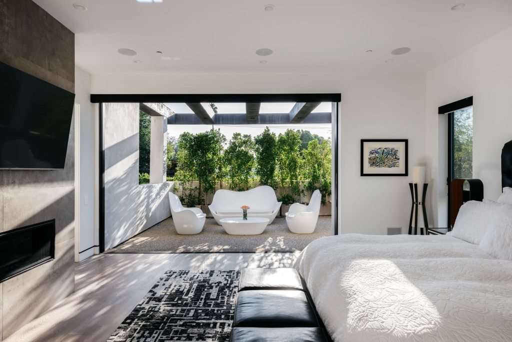 The Los Angeles Home is a beautifully scaled newer construction smart property has rooftop deck with fireplace, city and mountain views now available for sale. This home located at 439 N Martel Ave, Los Angeles, California;