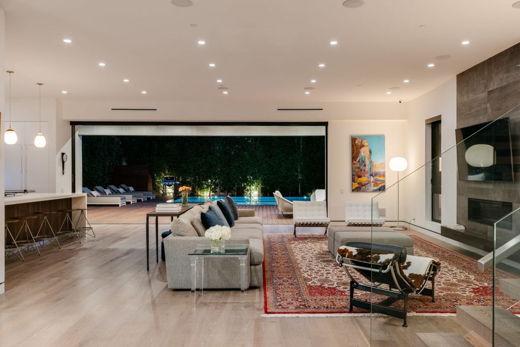 The Los Angeles Home is a beautifully scaled newer construction smart property has rooftop deck with fireplace, city and mountain views now available for sale. This home located at 439 N Martel Ave, Los Angeles, California;