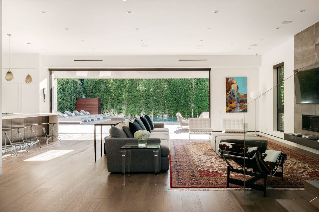 The Los Angeles Home is a beautifully scaled newer construction smart property has rooftop deck with fireplace, city and mountain views now available for sale. This home located at 439 N Martel Ave, Los Angeles, California;
