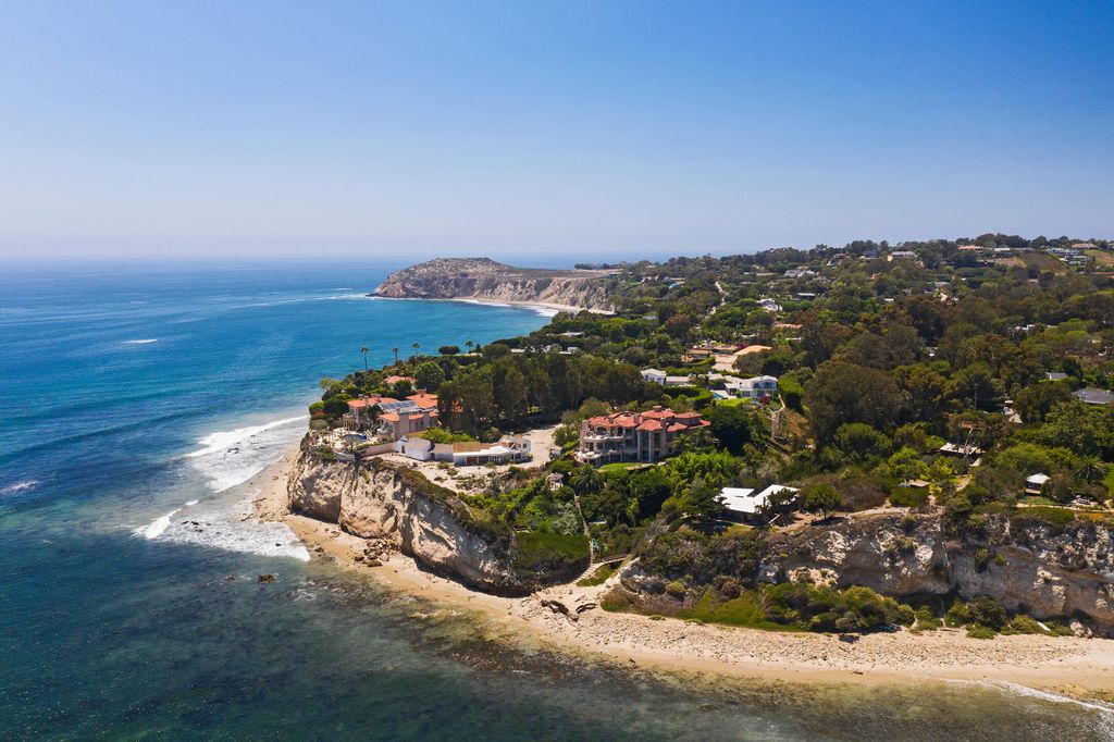 The Estate in Malibu is a ultra-private cul-de-sac estate commands gorgeous ocean, whitewater, and coastline views now available for sale. This home located at 28808 Cliffside Dr, Malibu, California