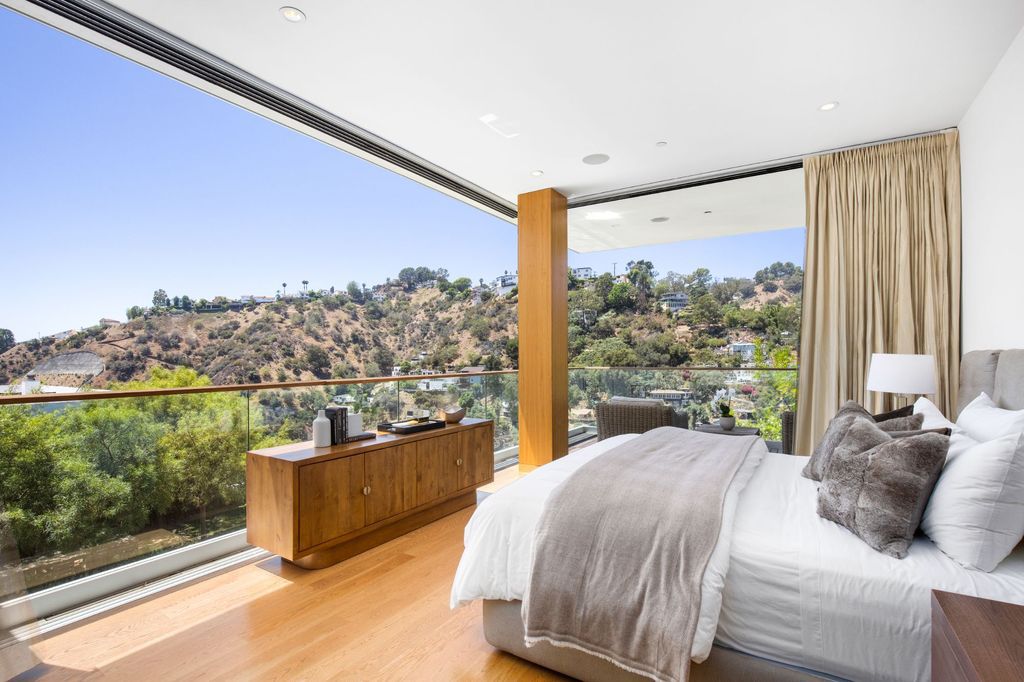 The Home in Los Angeles is a newly built modern architectural estate with the explosive city and canyon views now available for sale. This home located at 1967 Mount Olympus Dr, Los Angeles, California