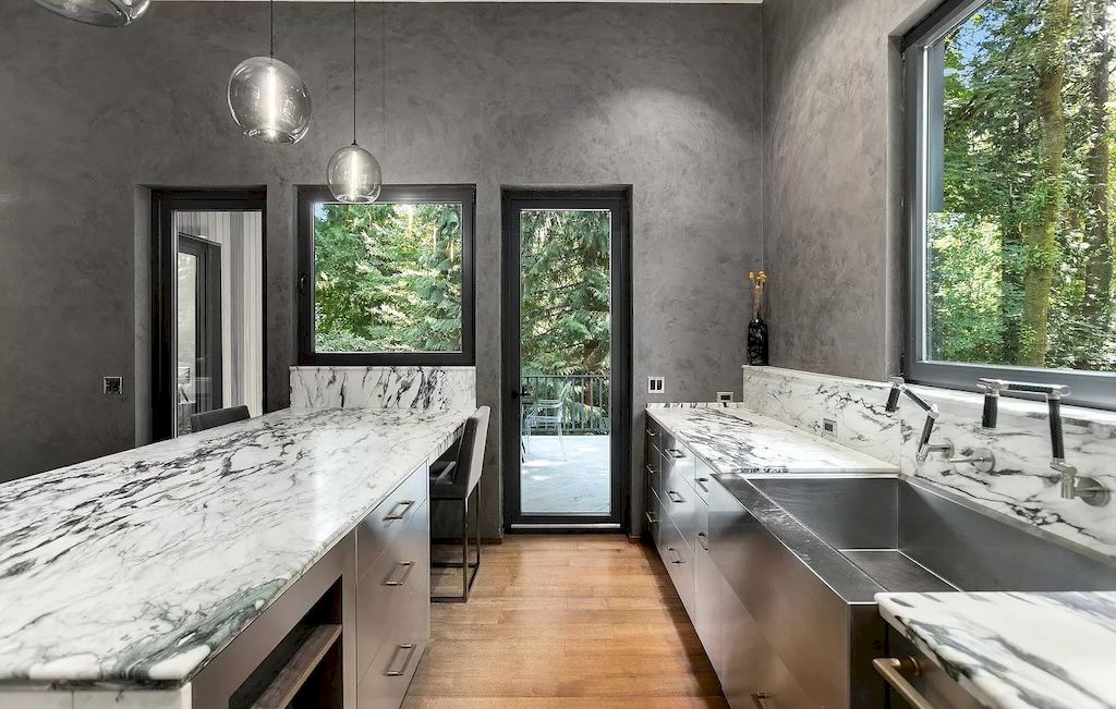 Granite countertops in dark shades such as black or deep grey bring a touch of opulence to your kitchen. The natural patterns and variations in the stone create a unique and luxurious look. Combine them with white or cream-colored cabinets for a striking contrast that showcases the beauty of the granite. 