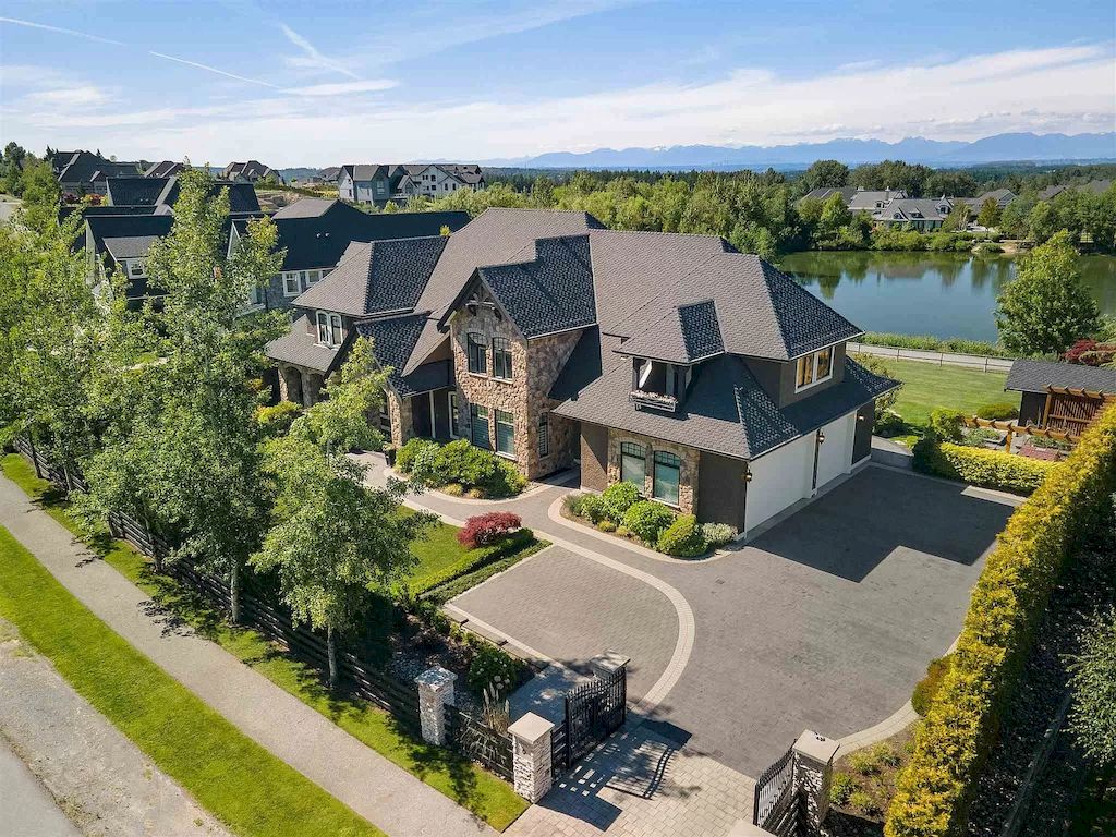 The European Country Style Home in Langley is a lakefront property with spectacular mountain views now available for sale. This home is located at 20067 1st Ave, Langley, BC V2Z 0A4, Canada
