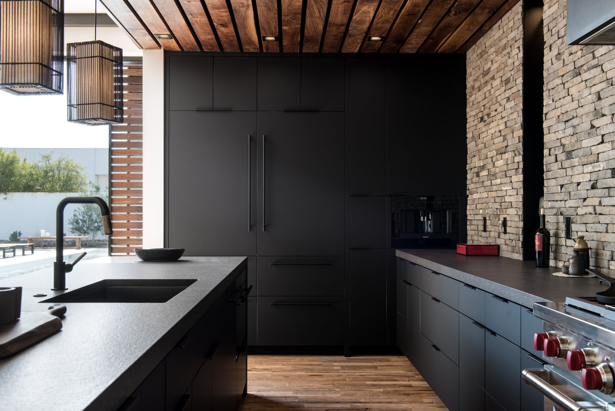 Matte black cabinets make a genuinely striking impression. Matte coatings have a velvety feel that adds depth and character to your kitchen. Combine sleek, modern hardware with light-colored countertops and backsplashes to create a dramatic contrast that showcases the beauty of the black. 