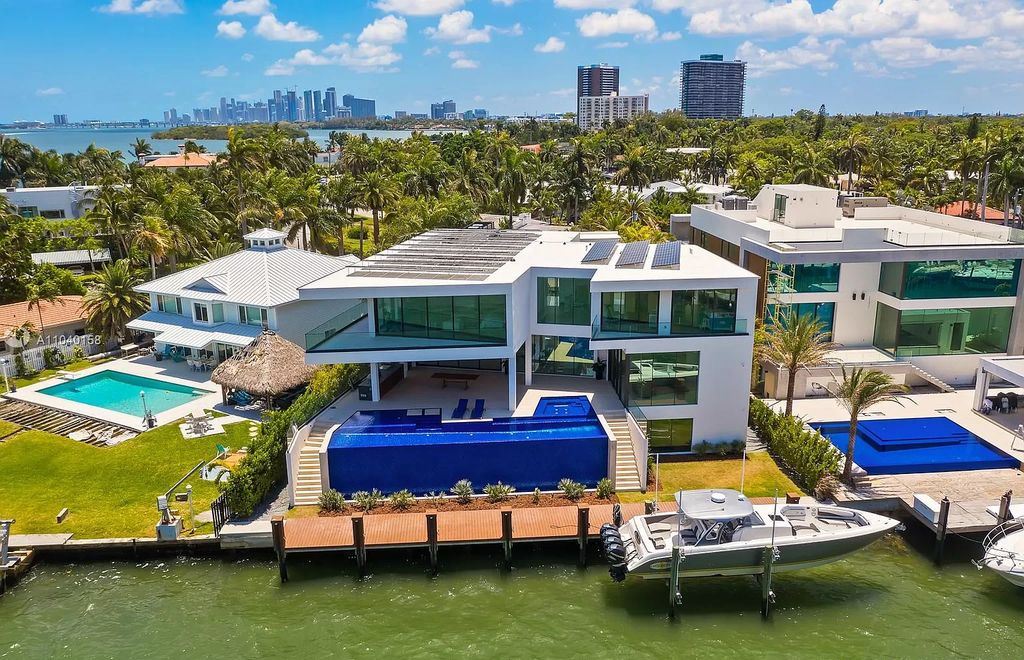 The Home in Miami is a brand new luxury modern estate with stunning bay views and over 100 feet of linear waterfront now available for sale. This home located at 1133 Belle Meade Island Dr, Miami, Florida