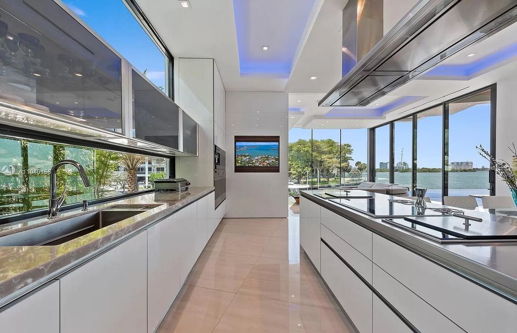 The Home in Miami is a brand new luxury modern estate with stunning bay views and over 100 feet of linear waterfront now available for sale. This home located at 1133 Belle Meade Island Dr, Miami, Florida
