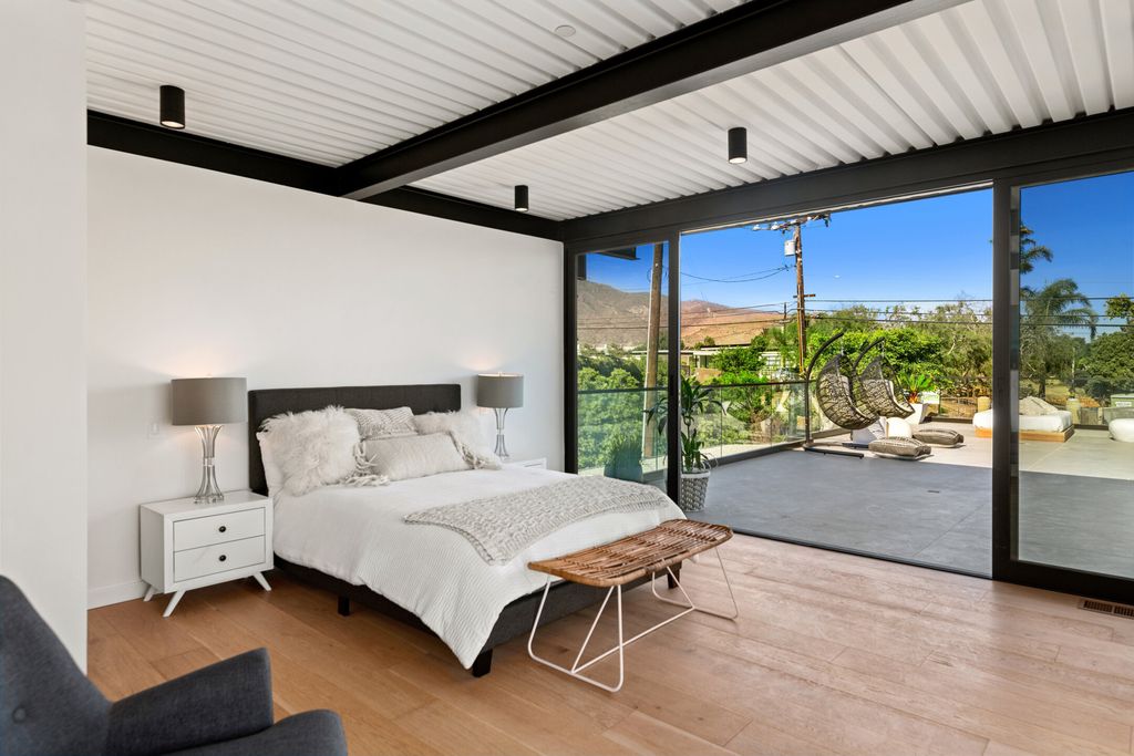 The Home in Malibu is a brand new architectural residence with vanishing glass doors and now a sensational backyard with its ocean views now available for sale. This home located at 5737 Busch Dr, Malibu, California