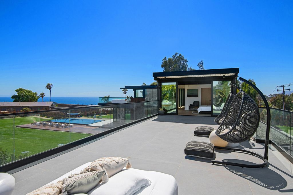 The Home in Malibu is a brand new architectural residence with vanishing glass doors and now a sensational backyard with its ocean views now available for sale. This home located at 5737 Busch Dr, Malibu, California