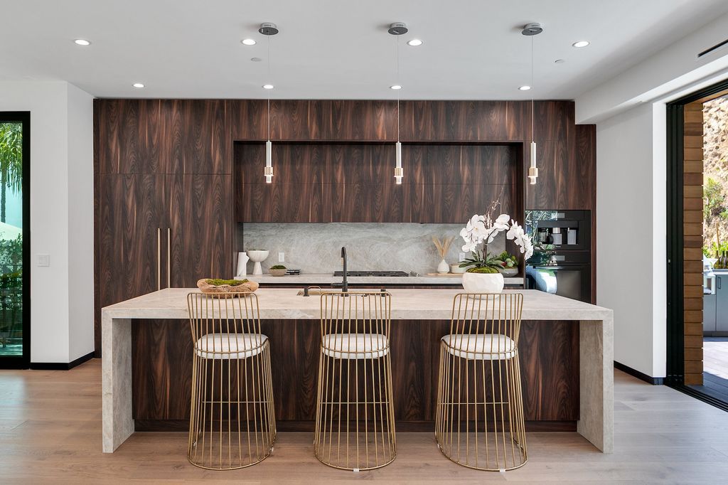 The Contemporary Home in Los Angeles is a brand new construction with incredible scale, and flooded with an abundance of natural light now available for sale. This home located at 1461 Rising Glen Rd, Los Angeles, California;