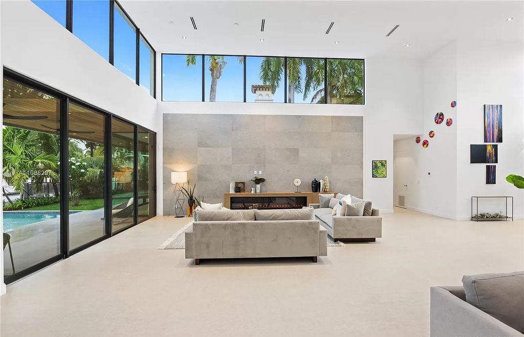 The Miami Home is a stunning brand new modern estate with enormous impact windows and doors offering an abundance of natural light now available for sale. This home located at 7362 SW 104th St, Miami, Florida
