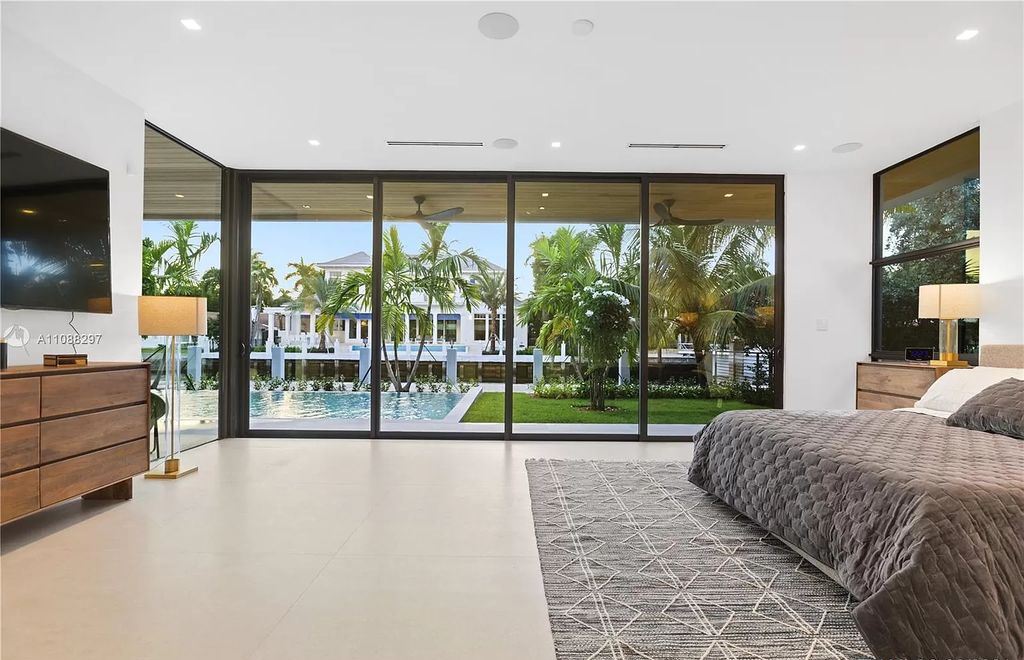 The Miami Home is a stunning brand new modern estate with enormous impact windows and doors offering an abundance of natural light now available for sale. This home located at 7362 SW 104th St, Miami, Florida