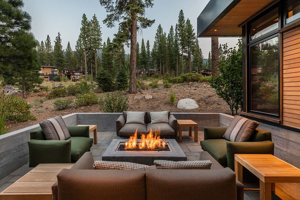 The Martis Camps Home is a stunning retreat with a beautiful great room and supported by a dining room and an elegant kitchen with a large counter now available for sale. This home located at 8324 Kenarden Dr, Truckee, California;