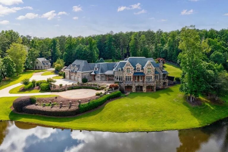 Discover Luxury and Privacy in this Lakefront Estate on 8+ Acres with Resort-Style Amenities and Impressive Features