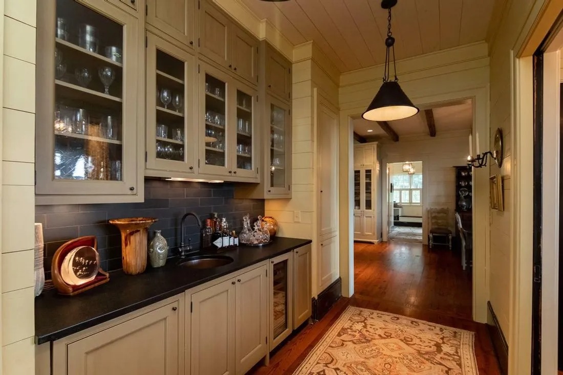 Cottage kitchens are known for their playful and whimsical vibe, so don't be afraid to add a touch of fun to your kitchen design. One way to achieve this is by incorporating unexpected elements such as a patterned tile backsplash, colorful pendant lights, or a unique piece of artwork. You can also experiment with patterned or textured wallpaper to add interest to the walls of your kitchen. Another way to add a touch of whimsy is by incorporating open shelving to display your favorite dishes or adding a chalkboard wall for jotting down notes or grocery lists.