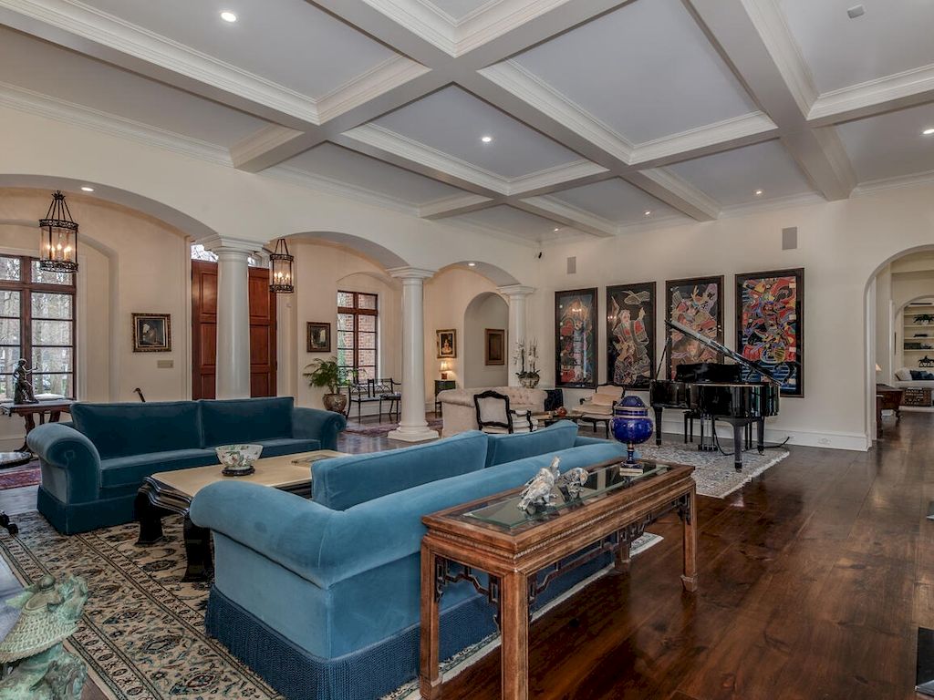 If you want a dynamic aesthetic in your living room that breaks up all the monochrome and neutral colors, a sleek navy blue sectional like this one can help. Warm velvet and a light navy color scheme complement the ancient wooden furniture, which is indicative of a classic setting. The handle, on the other hand, breaks up the monotony of the sofa set's design.