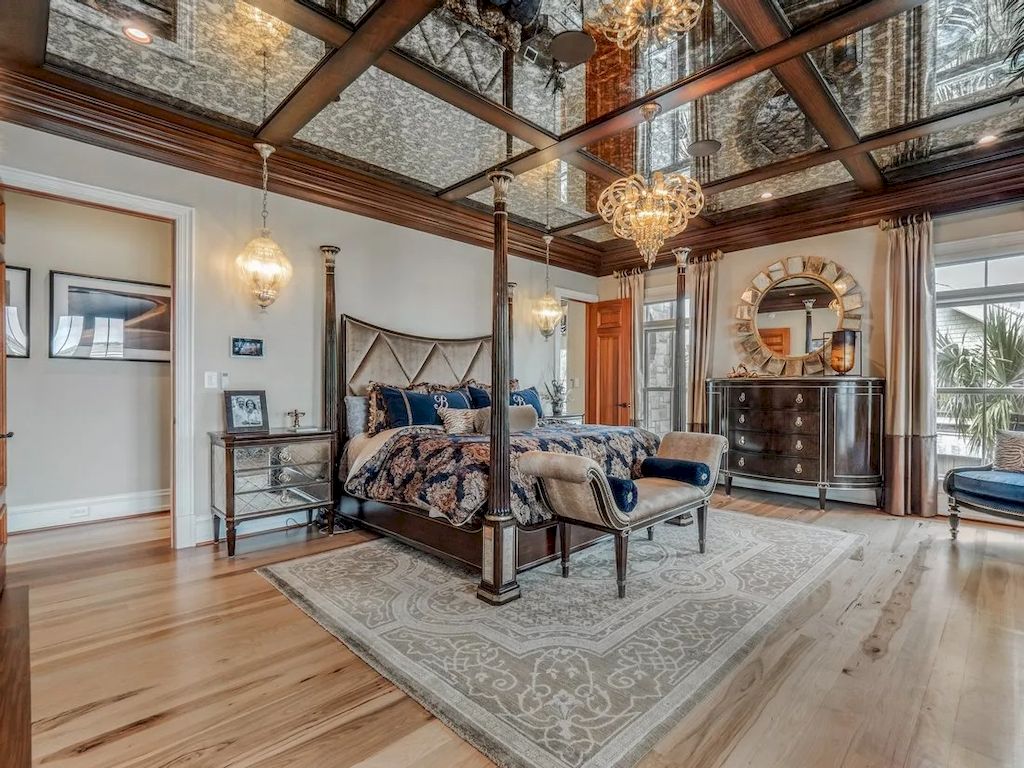 An impressive and unique bedroom design with a glass ceiling with a matte pattern creates a luxurious feeling. A pair of sophisticated chandeliers with soft golden light reflects light on the glass, making the ceiling look like a sky with thousands of shimmering stars. Truly a masterpiece!