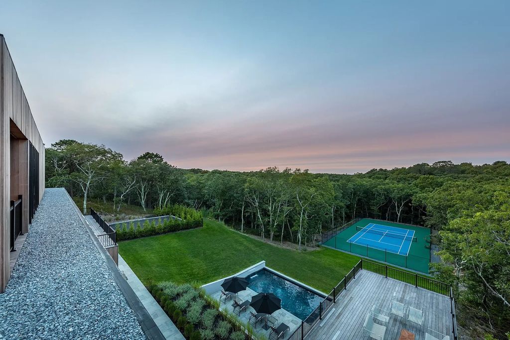 Modern new construction house in New York sets on 1.8 acres of lushly landscaped lot sells for $4,750,000