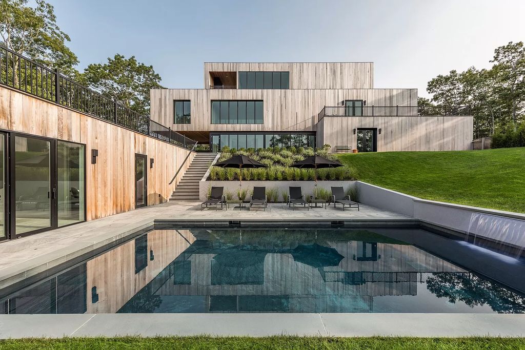 Modern new construction house in New York sets on 1.8 acres of lushly landscaped lot sells for $4,750,000