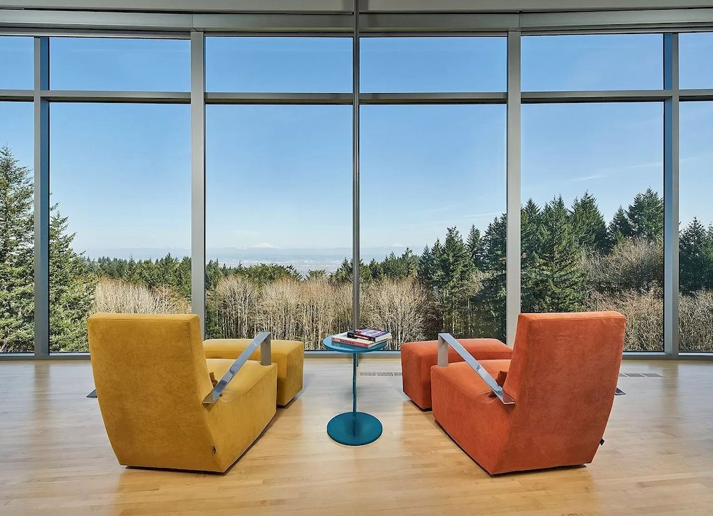 The Architecturally Significant Contemporary House in Oregon offers the perfect balance between function & form now available for sale. This home is located at 9912 NW Wind Ridge Dr, Portland, Oregon