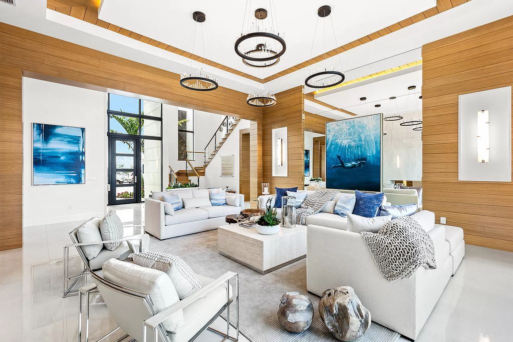 The Boca Raton Home is a Contemporary estate on a magnificent point pie lot with spectacular lake view in Boca Bridges now available for sale. This home located at 17230 Brulee Breeze Way, Boca Raton, Florida