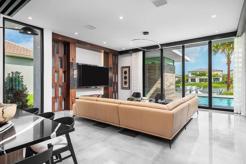 The Home in Boca Raton is a modern one story estate features a fabulous entertaining backyard with upgraded summer kitchen now available for sale. This home located at 17242 Brulee Breeze Way, Boca Raton, Florida