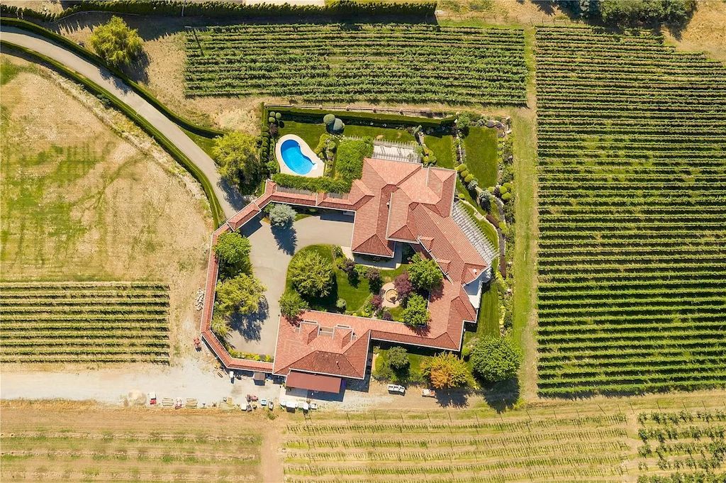 The Charming Italian Style Villa in Kelowna is a private country estate now available for sale. This home is located at 3240 Pooley Rd, Kelowna, BC V1W 4G7, Canada