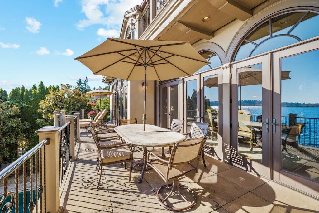 The Magnificent Waterfront House in Washington features romantic blue lake views now available for sale. This home is located at 10907 80th Pl NE, Kirkland, Washington