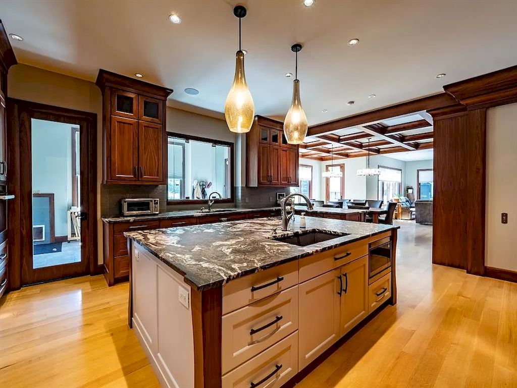 The Old World Style Residence in Alberta includes walnut or mahogany built-ins in many rooms and quarter sawn white oak flooring throughout now available for sale. This home is located at 4324 NW Anne Ave SW, Calgary, AB T2S 1L9, Canada