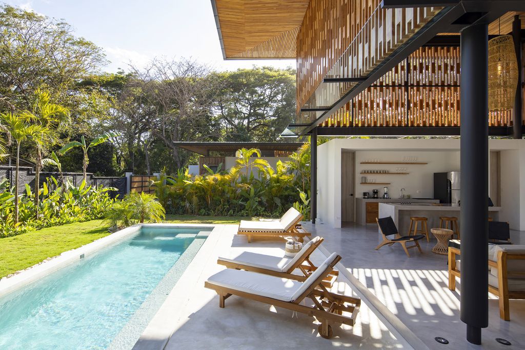 Naia House with teak roof, opens up Costa Rican rainforest by Studio Saxe