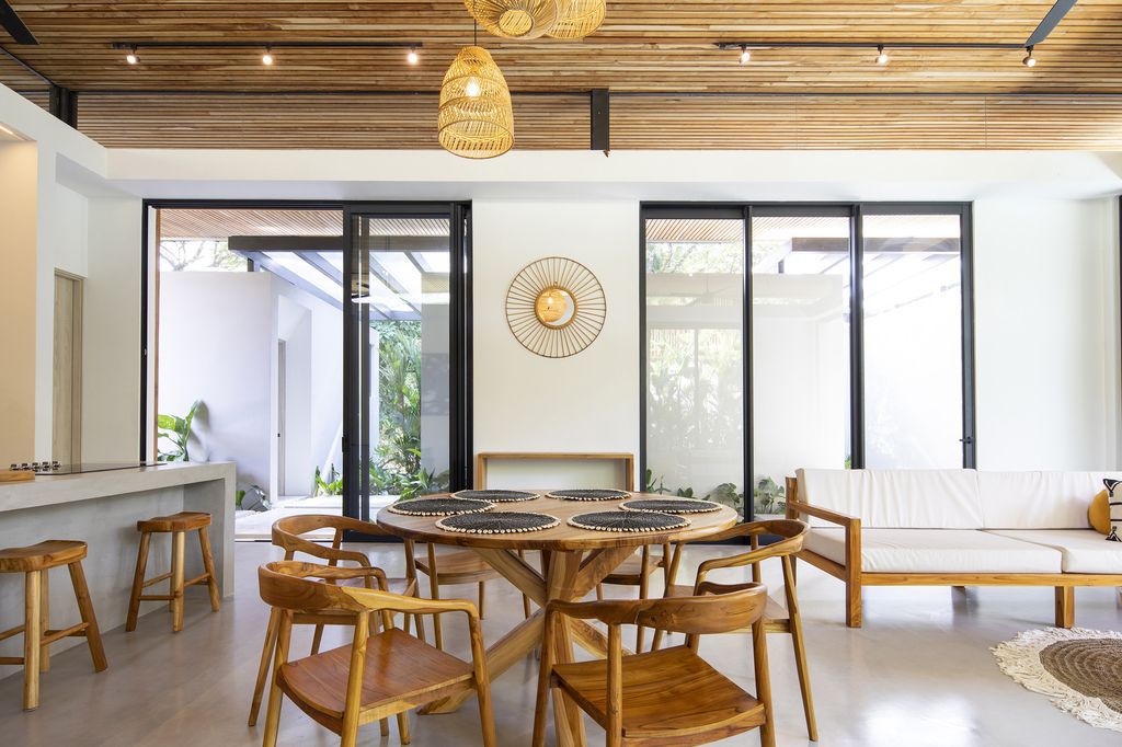 Naia House with teak roof, opens up Costa Rican rainforest by Studio Saxe