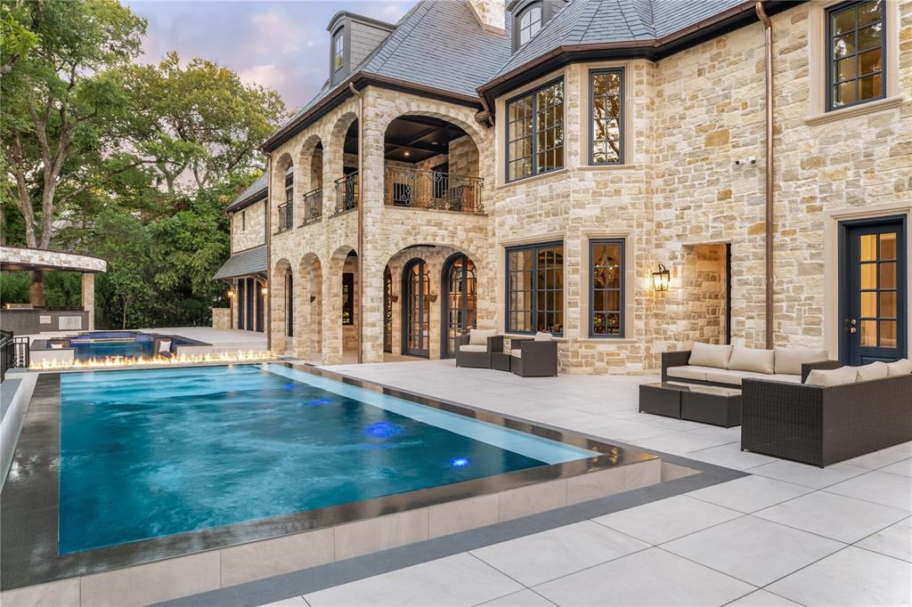 The mansion in Dallas is a 1.3 acre gated estate features an 18,769 SF main house was reimagined and transformed now available for sale. This home located at 9727 Audubon Pl, Dallas, Texas